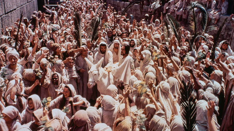 Jesus Christ is surrounded by his followers in the greatest story narrated