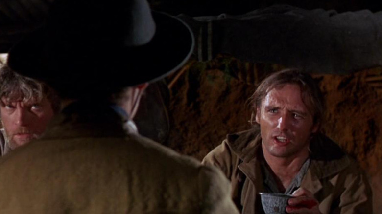 Dennis Hopper as Moon holding a teacup in True Grit (1969)