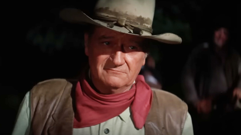 John Wayne's Wil Andersen looks across frame in The Cowboys