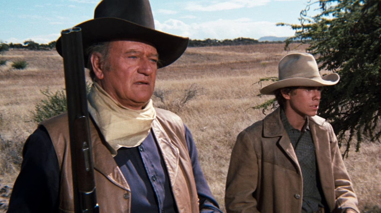 John Wayne as JD Cahill tracks down outlaws with Gary Grimes as Daniel Cahill in Cahill US Marshal