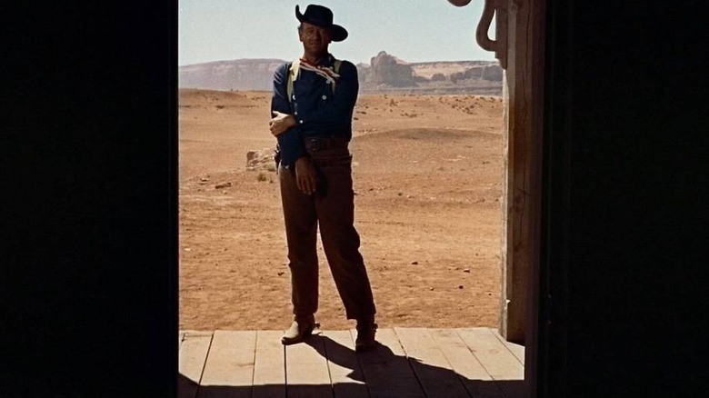 John Wayne standing in doorway