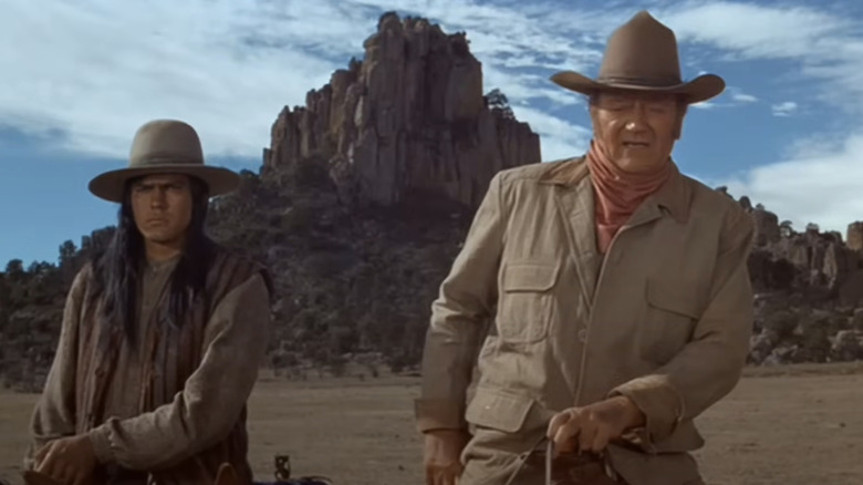 Colonel John Henry Thomas sits in the John Wayne Union Army on a horse next to the Blue Romanian Gabriel