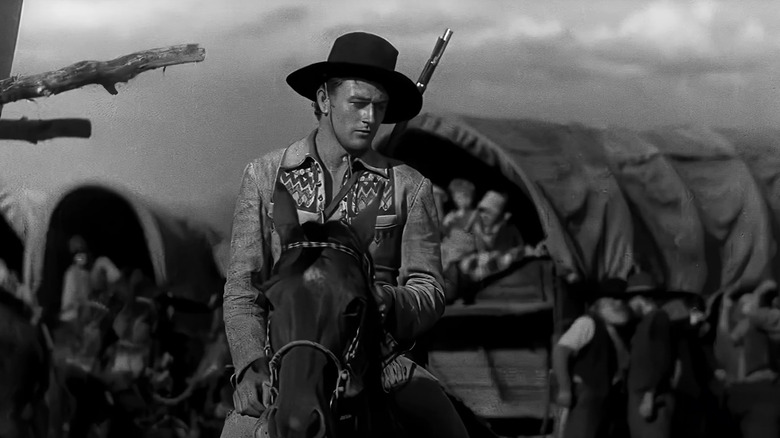 John Wayne as Breck Coleman sits on his horse in The Big Trail