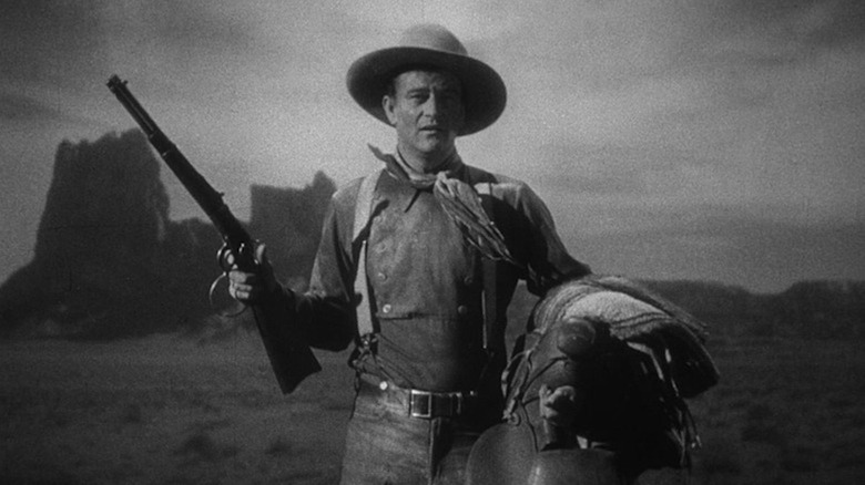 John Wayne wields a rifle as The Ringo Kid in Stagecoach