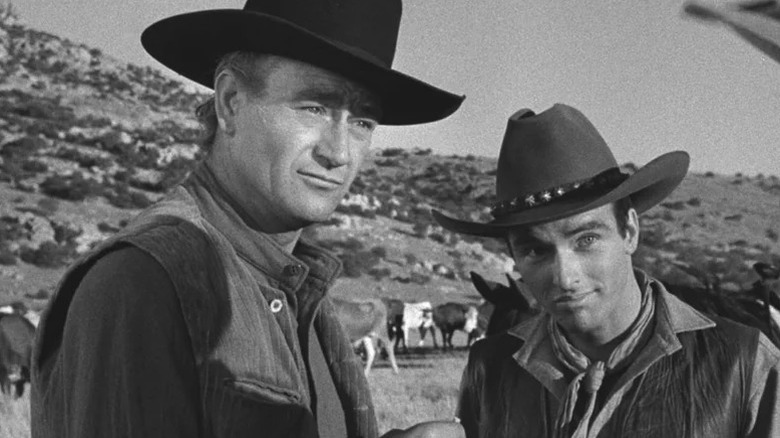 Thomas Dunston (John Wayne) and Matt Garth (Montgomery Clift) look on in Red River