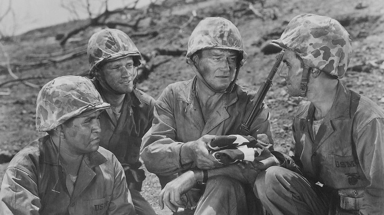 Sgt. Stryker (John Wayne) with some fellow soldiers in Sands of Iwo Jima