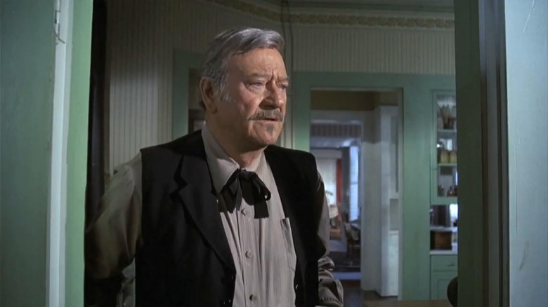 John Wayne as J.B. Books looking distraught in The Shootist