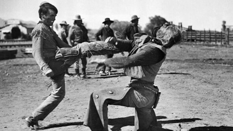 Montegamer Cleef in the role of Matt Garthath, kicking John Wayne in the role of Thomas Donson in his face in Red River in his face