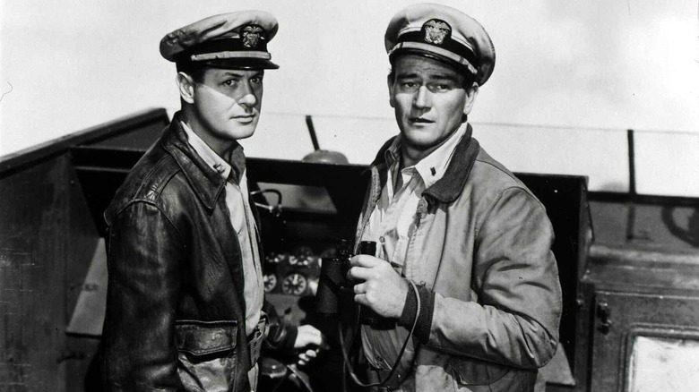 John Wayne as Lt. Rusty Ryan and Robert Montgomery as  Lt. John Brickley looking forward in They Were Expendable