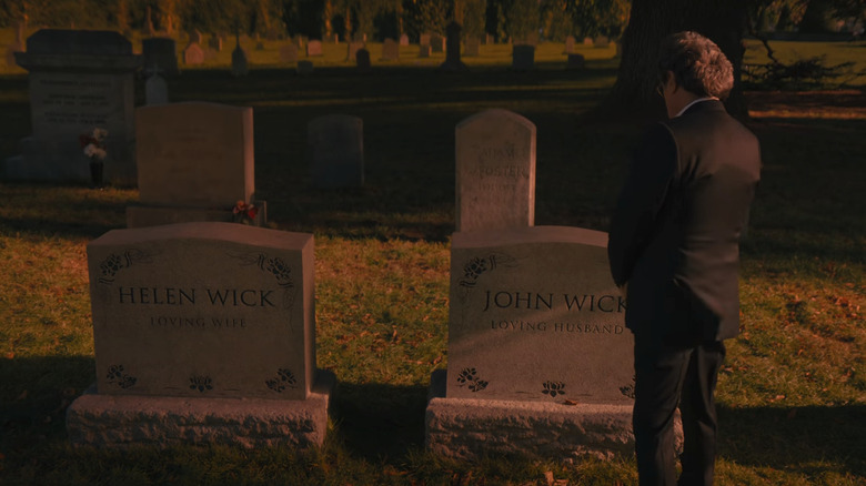 Ian McShane's Winston stands in front of John and Helen Wick's Graves in John Wick in Chapter 4