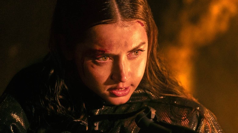 Ana de Armas as Eve in Ballerina with a cut forehead looking down