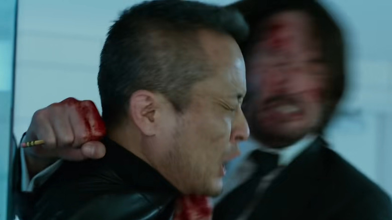 John Wick ramming a man's head into a pencil