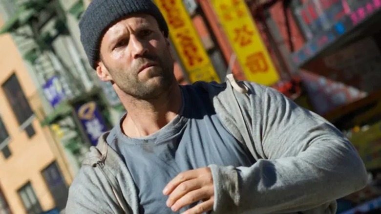 Jason Statham looks deeply concerned in a coherent hat like Luke Wright in the beekeepers