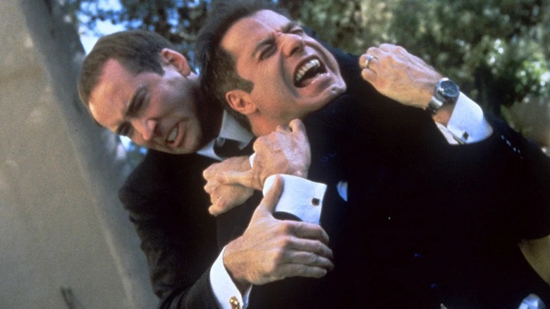 Sean Archer and Castor Troy try to kill each other in Face/Off