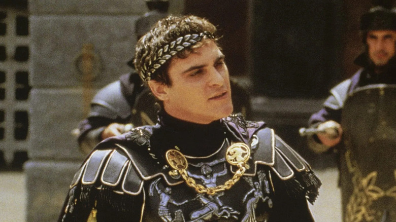 Commodus wearing his crown and looking at someone in the arena in Gladiator