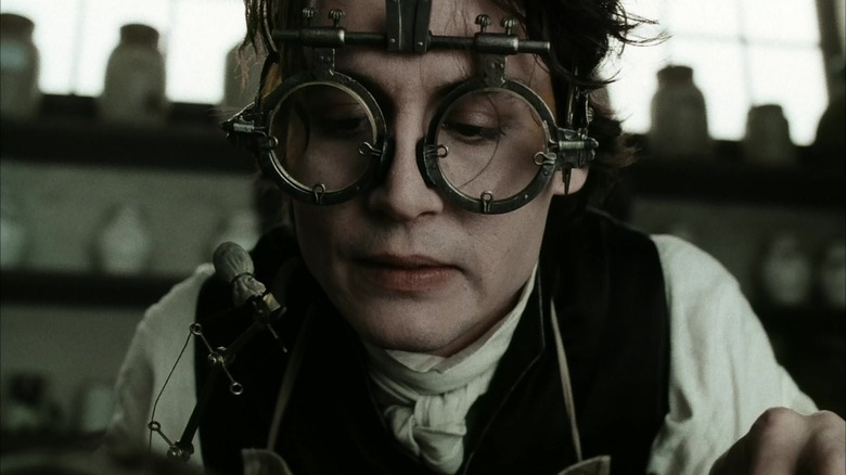 Ichabod Crane inspects something with his own devices in Sleepy Hollow