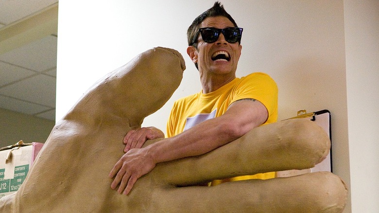 Johnny Knoxville holding the big high five hand in Jackass 3D