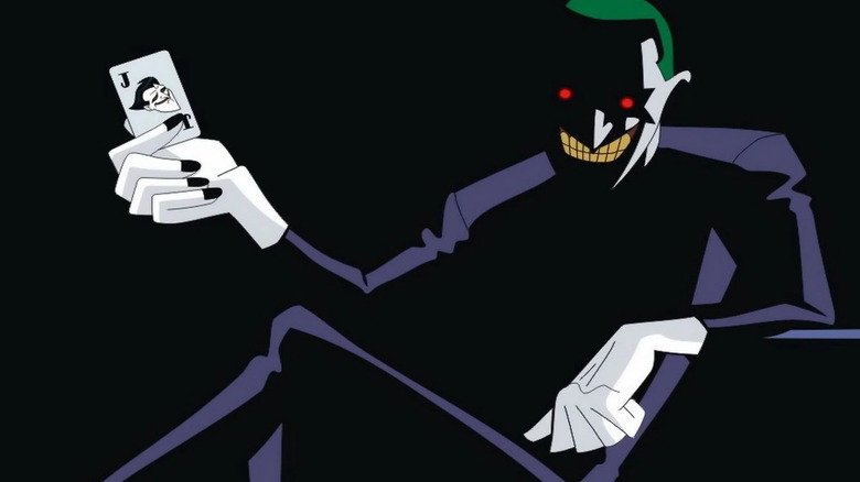Tim Drake as the Joker holding a Joker card in Batman Beyond: Return of the Joker