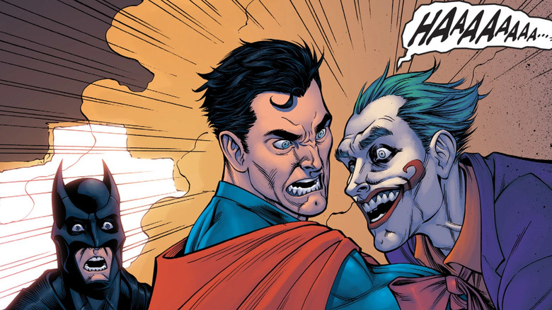 Superman impales the Joker with his arm as Batman watches