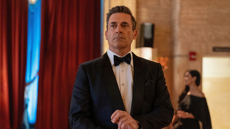 Coop wearing a tux and adjusting his cuffs in Your Friends and Neighbors
