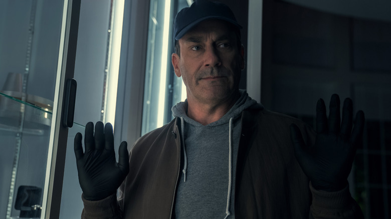 Coop with his hands up mid-theft in Your Friends & Neighbors