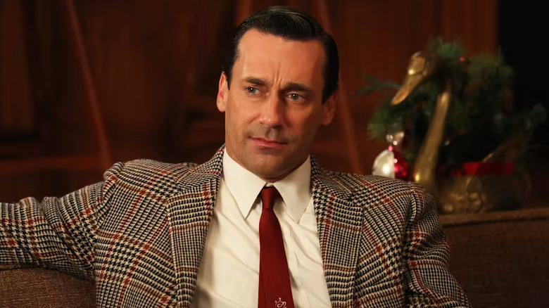 Don in a patterned suit looking pensive on Mad Men
