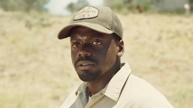 Daniel Kaluuya's Otis Haywood Jr stands in a desert landscape in Nope
