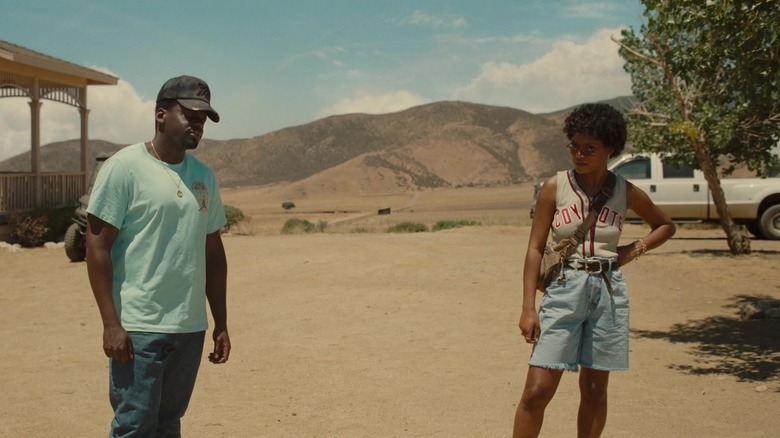Daniel Kaluuya's Otis Haywood Jr stands alongside Keke Palmer's Emerald Haywood in a desert landscape in Nope