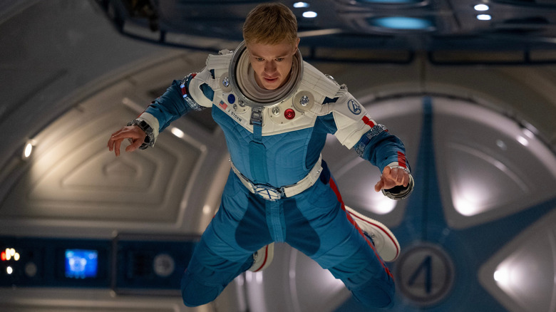 Joseph Quinn as Johnny Storm, hovering in zero gravity in The Fantastic Four: First Steps