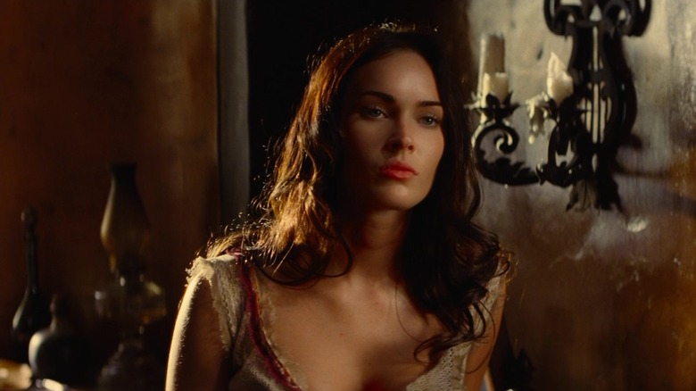 Megan Fox as Lilah Black standing against a wall in Jonah Hex (2010)