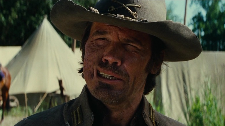 Josh Brolin as Jonah Hex standing next to a camp in Jonah Hex (2010)