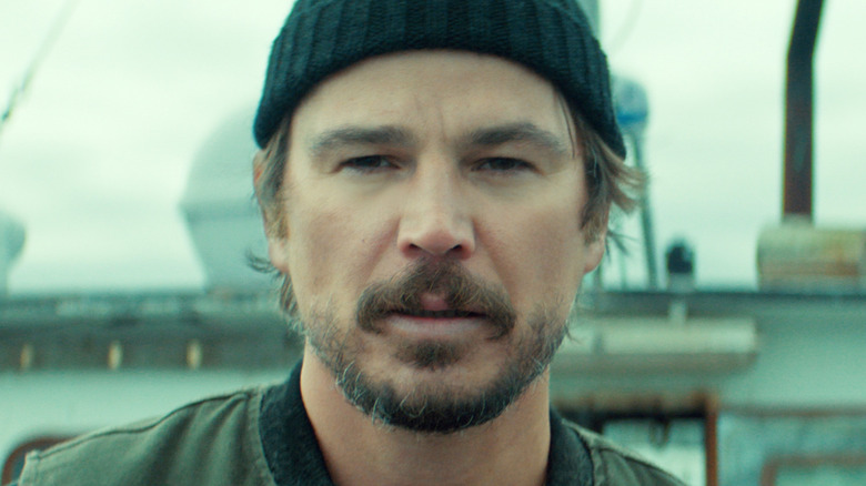Josh Hartnett as Calving standing on a boat in Below