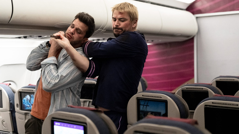 Lucas Reyes choking an assassin on a plane in Fight or Flight