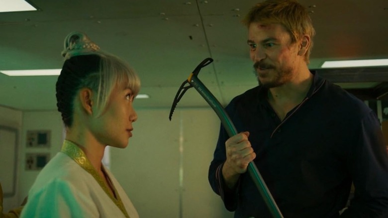 Lucas Reyes enthusiastically showing an ice axe to Mae in Fight or Flight