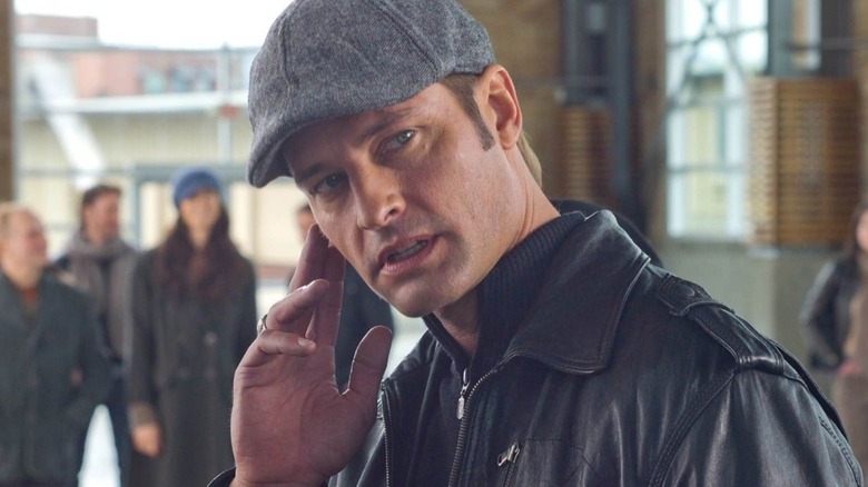 Josh Hulwai in the mission: Impossible - Ghost Protocol wears a hat and touched his face