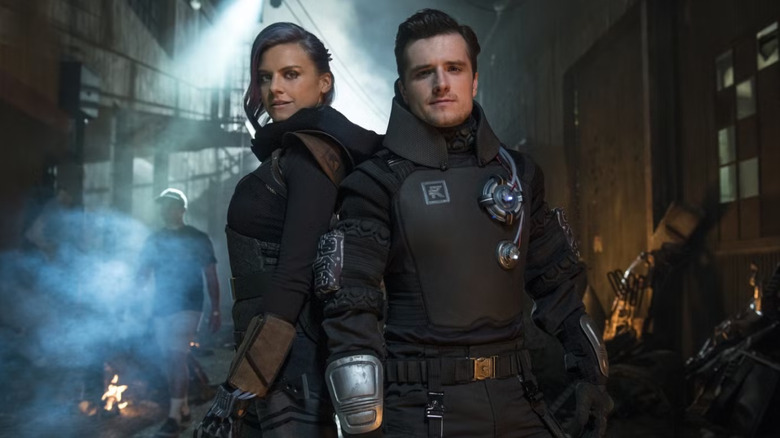 Eliza Coupe as Tiger and Josh Hutcherson as Josh pretending to be the video game character Wolf in Future Man
