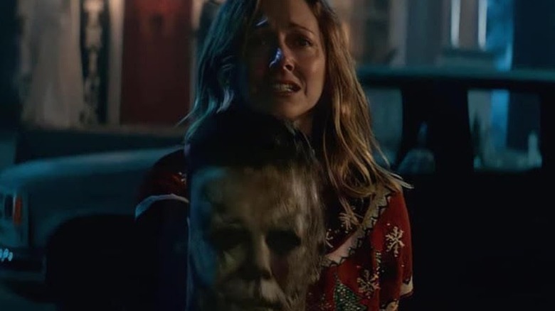Karen holding Michael Myers' mask