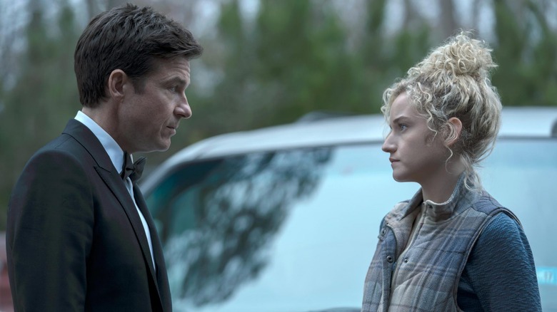 Jason Bateman Julia Garner staring