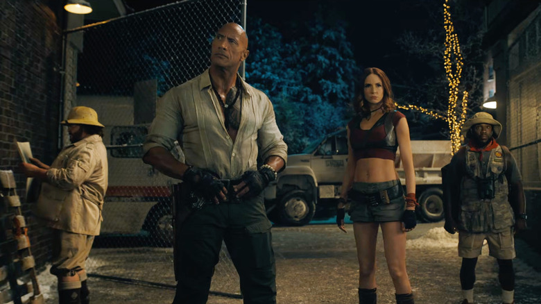 The Jumanji avatars standing together in the real world in Jumanji: Open World