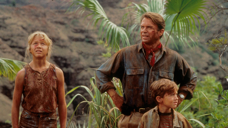Lex, Dr. Grant and Tim in the woods in Jurassic Park