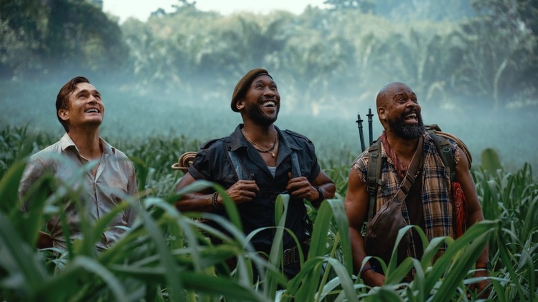 Krebs, Kincaid, and Leclerc smiling as they look up in Jurassic World Rebirth