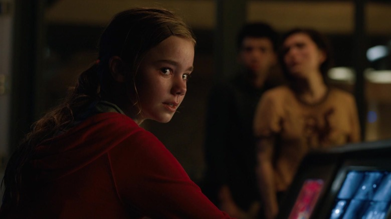 Maisie unlocking the gates that frees the dinosaurs in Jurassic World: Fallen Kingdom