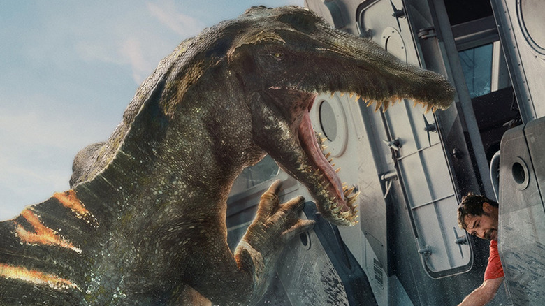 The Spinosaurus getting ready to attack Reuben on the D-box poster for Juarssic World Rebirth