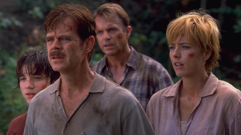 The Kirby family and Dr. Grant standing together in Jurassic World Rebirth