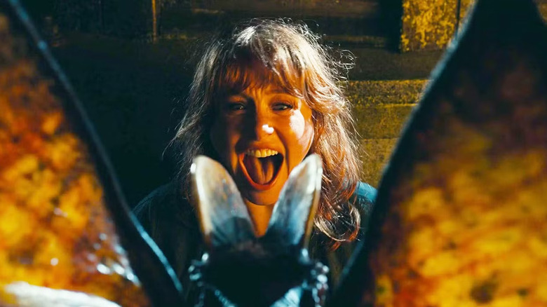 Clare Dearing faces down a Dilophosaurus in Jurassic World: Dominion