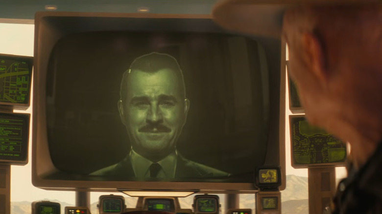 Justin Theroux as Mr. House smiling on a television screen as Walton Goggins as the Ghoul watches in Fallout season 2