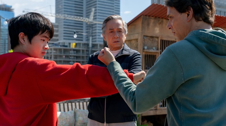 Li sparring with Daniel while Mr. Han looks on in Karate Kid: Legends.