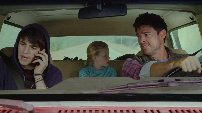 Charlie Rowe as Ricky, Angourie Ric as Jade, and Karl Urban as Zack riding in a truck in Walking with Dinosaurs (2013)