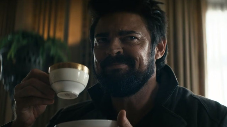 Karl Urban as Billy Butcher with a little teacup and a wicked smirk on The Boys