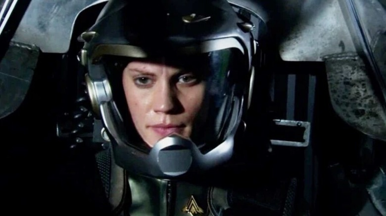Katee Sackhoff as Starbuck on Battlestar Galactica, wearing her helmet and space suit